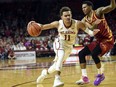 OKlahoma's Trae Young, left, drives past Iowa State's Donovan Jackson, right, in the second half of an NCAA college basketball game Friday, March 2, 2018, in Norman, Okla.