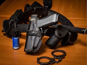 A police officer's tool belt, including a firearm, OC spray and baton. Edmonton police used force more than 2,400 times last year.