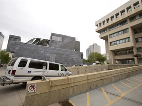 An Alberta Sheriffs van enters the Edmonton Law Courts garage, in downtown Edmonton in a 2014 file photo. On at least two occasions, a sexual assault victim taken into custody in 2015 on the mistaken belief that she was a "flight risk" was transported from the Remand Centre in the same van as the man ultimately convicted of attacking her.