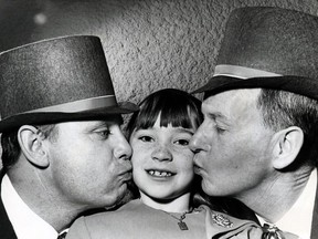 Eight-year-old Moira Hogan is kissed on the cheek by her brother Patrick, left, and Timothy Coghlain during a St. Patrick's Day dance held by the Irish Sports and Social Society at the Edmonton Inn on March 17, 1967.