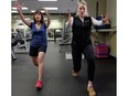 Edmonton Journal writer and budding tennis player Liane Faulder (left) gets tennis exercise tips from fitness expert Krystle Johner.