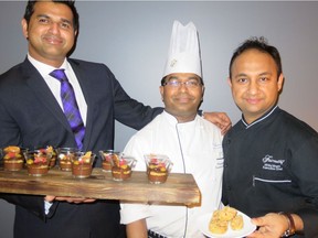 Offering samples of the dishes being served at Downtown Dining Week are food and beverage manager Antosh Shetty, left, chef Vinayak Walve and executive chef Mridul Bhatt of the Fairmont Hotel Macdonald. Meals include crunchy chocolate cremo pot dessert with a passion fruit gel, left, and soft shell crab.