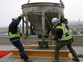 The ceremonial last bucket of concrete is poured on the 17th floor rooftop at 100 West Block on Friday March 16, 2018, to commemorate Edmonton's first mixed-use, transit-oriented residential development.