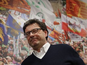The League Giancarlo Giorgetti arrives at the party headquarters in Milan to comment first electoral results, Monday night, March 5, 2018. More than 46 million Italians were voting Sunday in a general election that is being closely watched to determine if Italy would succumb to the populist, anti-establishment and far-right sentiment that has swept through much of Europe in recent years.