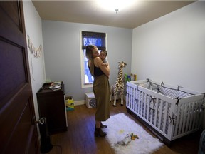 Julia Lipscombe and her son Indiana Lipscombe pose for a photo in their Edmonton home, Thursday Feb. 2, 2017.