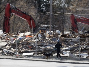 A jogger goes past the site of the former Blue Chicago restaurant which has been demolished to make way for new development at 142 Street and Stony Plain Road, in Edmonton on Sunday April 8, 2018.