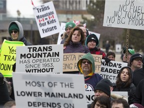 Protesters in favour of the Trans Mountain pipeline expansion gather, chant and wave signs outside the Alberta legislature in Edmonton on Thursday, April 12, 2018.