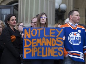 NDP MLAs including Danielle Larivee, Stephanie McLean and Deron Bilous take part in a pro Trans Mountain pipeline expansion rally outside the Alberta legislature, in Edmonton on Thursday, April 12, 2018.