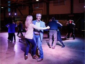 Couples dance during the Blatchford Boogie Woogie at the Alberta Aviation Museum in Edmonton on Saturday, April 7, 2018.