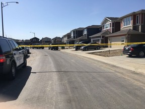 Police tape blocks off a section of 219 Street in Rosenthal on Saturday, April 28, 2018.