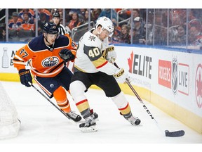 Keegan Lowe #47 of the Edmonton Oilers battles against Ryan Carpenter #40 of the Vegas Golden Knights at Rogers Place on April 5, 2018.