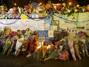 TORONTO, CANADA -  APRIL 24:  Flowers, cards, and words of sympathy adorn a makeshift memorial for victims of the mass killing on April 24, 2018 in Toronto, Canada. A suspect identified by police as Alek Minassian, 25, is in custody after a driver in a white rental van yesterday sped onto a crowded sidewalk, killing 10 and injuring at least 16.