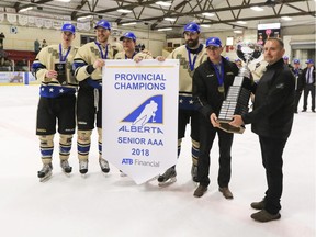 Lacombe Generals captain Don Morrison, second from right, along with the Generals leadership core, accepts the provincial cup following the Generals Senior AAA championship win on March 21, 2018, at the Gary Moe Auto Group Sportsplex in Lacombe, Alta. Morrison, who suffered a severe neck injury in January, will not lead his team into the Allan Cup tournament.