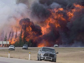 A giant fireball is seen as a wild fire rips through the forest 16 km south of Fort McMurray, Alta., on highway 63 on May 7, 2016. Federal officials raised the possibility of relaxing competition and fuel quality rules to ensure a stable supply of fuel while the Fort McMurray wildfire raged and forced several northern Alberta oilsands projects to shut down.
File photo.