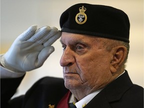 Royal Canadian Legion (Kingsway Branch) member O.K. Schneider salutes during an Anzac Day Service in Edmonton on Sunday April 22, 2018.