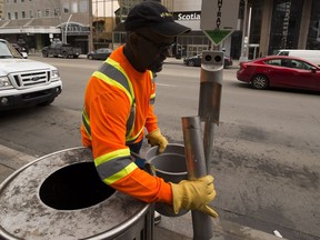 Bee-Clean Building Maintenence worker Ahmed Ainab cleans a test ashtray on Jasper Avenue on Sunday, April 29, 2018 in Edmonton.