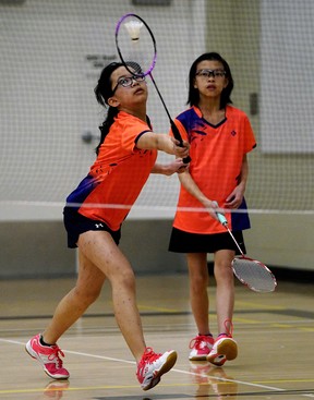 Anna Wong (left) and Jadlyn Lee (right) compete in doubles competition at the Yonex Alberta Junior Badminton Championships held at Olds College from April 13-15, 2018.  In the provincial badminton tournament, 248 athletes competed in 639 matches over three days.  competition.  (Photo by Larry Wong/Postmedia)