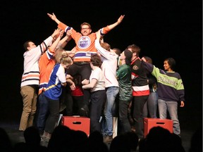 Rapid Fire artistic director Matt Schuurman is hoisted high during the Bonfire Festival debut Thursday.