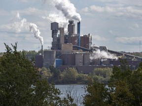 The Northern Pulp Nova Scotia Corporation mill is seen in Abercrombie, N.S. on October 11, 2017. An Environment Canada analysis says the federal government's carbon pricing plan will eliminate as much as 90 million tonnes of carbon dioxide by 2022. That is the equivalent to taking more than 20 million cars off the road and accounts for about 12 per cent of the total amount of what Canada emitted in 2016.