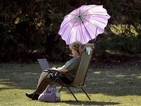 Nancy Oleinyk works on her novel at Hawrelak Park as temperatures reached 20C degrees in the sunshine on Thursday April 26, 2018. (PHOTO BY LARRY WONG/POSTMEDIA)