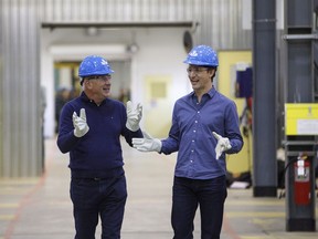 Prime Minister Justin Trudeau and Suncor CEO Steve Williams, left, tour Suncor's Fort Hills facility near Fort McMurray, Alta., on Friday, April 6, 2018.