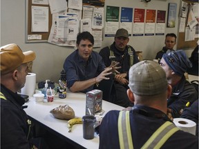Prime Minister Justin Trudeau meets with workers at Suncor's Fort Hills facility near Fort McMurray on Friday.