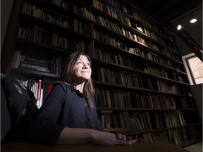 Rachel Bouchard and her collection of books at The Front Gallery.