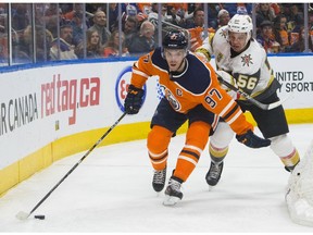 Vegas Golden Knights' Erik Haula (56) pressures Edmonton Oilers' Connor McDavid (97) during second-period NHL hockey game action in Edmonton, Alberta, Thursday, April 5, 2018. (Amber Bracken/The Canadian Press via AP) ORG XMIT: AKB110