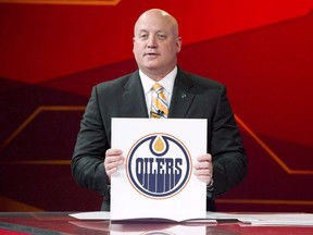 Deputy Commissioner of the NHL Bill Daly announces the top pick in the 2011 NHL Entry Draft to the Edmonton Oilers during the NHL Draft Lottery in Toronto Tuesday, April 12, 2011.