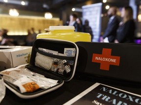 A naloxone kit is seen as Dr. Karen Grimsrud, chief medical officer of health, speaks about the Alberta government's $1.4 million in grants to fund 29 projects to address the opiate criss, at 99ten bar in Edmonton, on Thursday, April 5, 2018.