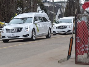 A hearse makes its way down 53 Avenue in Stony Plain following the funeral for Humboldt Broncos goaltender Parker Tobin on April 15, 2018.