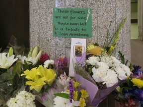 A memorial has been set up outside the Bunches flower shop at Southgate Centre mall after store employee Iain Armstrong died in hospital on Friday April 20, 2018. Armstrong had attempted to stop a robbery at a kiosk outside the shop and was beaten up by the suspect. He had worked at the shopping centre for 26 years and was well-known and well-respected. Province wide warrants have been issued for Jordan Martin Cushnie, 23, wanted for second-degree murder, robbery, mischief under $5,000 and possession of break and enter tools. Cushnie, about five-foot-nine, 135 pounds, is known to police and should not be approached, say investigators. Police believe Cushnie is armed and dangerous. (PHOTO BY LARRY WONG/POSTMEDIA)