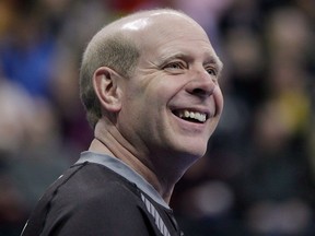 Skip Kevin Martin smiles during the first end of the men's semi-final against John Morris at the Roar of the Rings Canadian Olympic Curling Trials in Winnipeg on Dec. 7, 2013