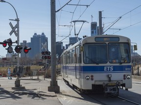 The Metro LRT Line approaches the Kingsway Avenue crossing near the Royal Alexandra Hospital on April 23, 2018.