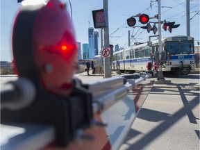 The Metro LRT Line approaches the Kingsway Avenue crossing near the Royal Alexandra Hospital on April 23, 2018.