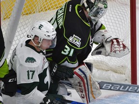 Edmonton Oil Kings goalie Josh Dechaine gets run into by Everett Silvertips forward Matt Fonteyne during WHL action at Rogers Place on Oct. 8, 2017.