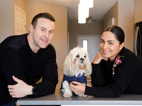 Ben Fuller and Jennifer Florez, with their dog Romeo, a five-year-old shih tzu, in their home in Paisley.