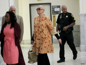 Camille Cosby, center, walks down into the courtroom at the Montgomery County Courthouse in Norristown, Pa., for husband, Bill Cosby's sexual assault retrial, Tuesday, April 24, 2018.