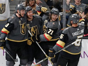 Vegas Golden Knights players celebrate a goal against the San Jose Sharks on March 31.