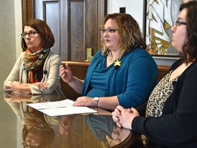 Health Minister Sarah Hoffman, centre, met with staff from Kensington Clinic ahead of introducing Bill 9, which would keep protesters at least 50 metres away from an abortion clinic.