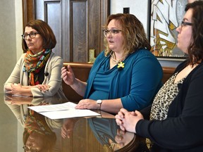 Minister of Health Sarah Hoffman, centre, met with staff from Kensington Clinic, Celia Posyniak, left, executive director and Jennifer Berard, right, administrative assistant, to discuss a growing concern for health professionals from protests, interference, harassment and intimidation around abortion services on Wednesday.