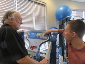 The Journal's Nick Lees jokes with Leading Edge physiotherapist Dalton Parker, who is explaining the workings of a gravity-free treadmill.