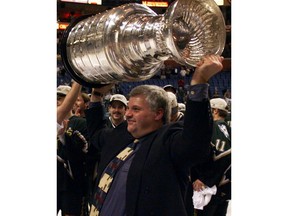 In this June 20, 1999, file photo, Dallas Stars coach Ken Hitchcock hoists the Stanley Cup after the Stars defeated the Buffalo Sabres 2-1 in triple overtime in Game 6 of the Stanley Cup finals in Buffalo, N.Y. Stars coach Ken Hitchcock is retiring, ending a 22-year career as the third-winningest coach in NHL history. Hitchcock will become a consultant for the team he led to its only Stanley Cup championship in 1999. (File)