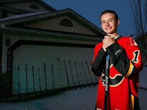 Shane DíArcy,16, outfront of his Sunvista Way home with his 16 stick tribute to the Humboldt Broncos in Calgary on Thursday April 12, 2018.