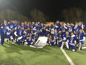 The Harry Ainlay Titans celebrate their Provincial High School Tier 1 Football championship in Lacombe, Alta., on Saturday, Nov. 25, 2017. The Titans defeated the St. Francis Browns of Calgary 12-3 in the final.