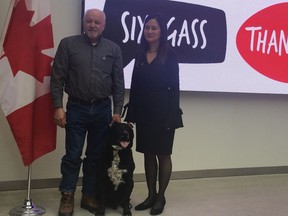 Ron Mistafa of Detector Dog Services International, a Calgary-based outfit that helps clients in the oil and gas sector with six-year-old George, a black-lab mix and Shauna-Lee Chai a scientist with InnoTech Alberta were at a program Friday at Singhmar Centre for Learning Atrium at NorQuest College to highlight the investments of almost $5.5 million for 11 projects across Alberta through the Western Diversification Program.