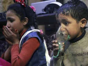 A child receiving oxygen through respirators following an alleged poison gas attack in the rebel-held town of Douma, near Damascus, Syria.