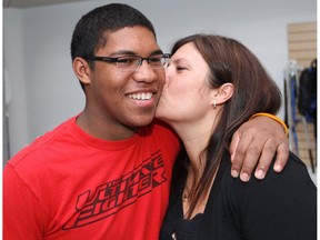Zachary Judd recieves a kiss from his mother Desiree Judd following a press conference at the Glenrose Rehabilitation Hospital in Edmonton, Friday Feb. 3, 2012. Zachary talked about his rehabilitation following a October 22, 2011 vehicle crash that killed four members of the his high school football team.