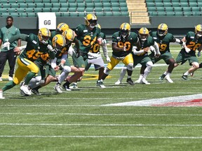 Eskimos denfense on the run during training camp at Commonwealth Stadium in Edmonton, May 22, 2018. Ed Kaiser/Postmedia