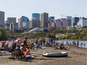 People enjoy a hot summer day on "Accidental Beach" in Edmonton on Tuesday, August 29, 2017.